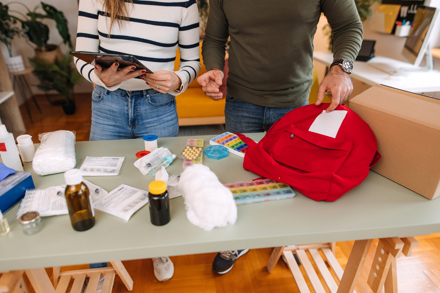 A table with items from a first aid kit spread out on it