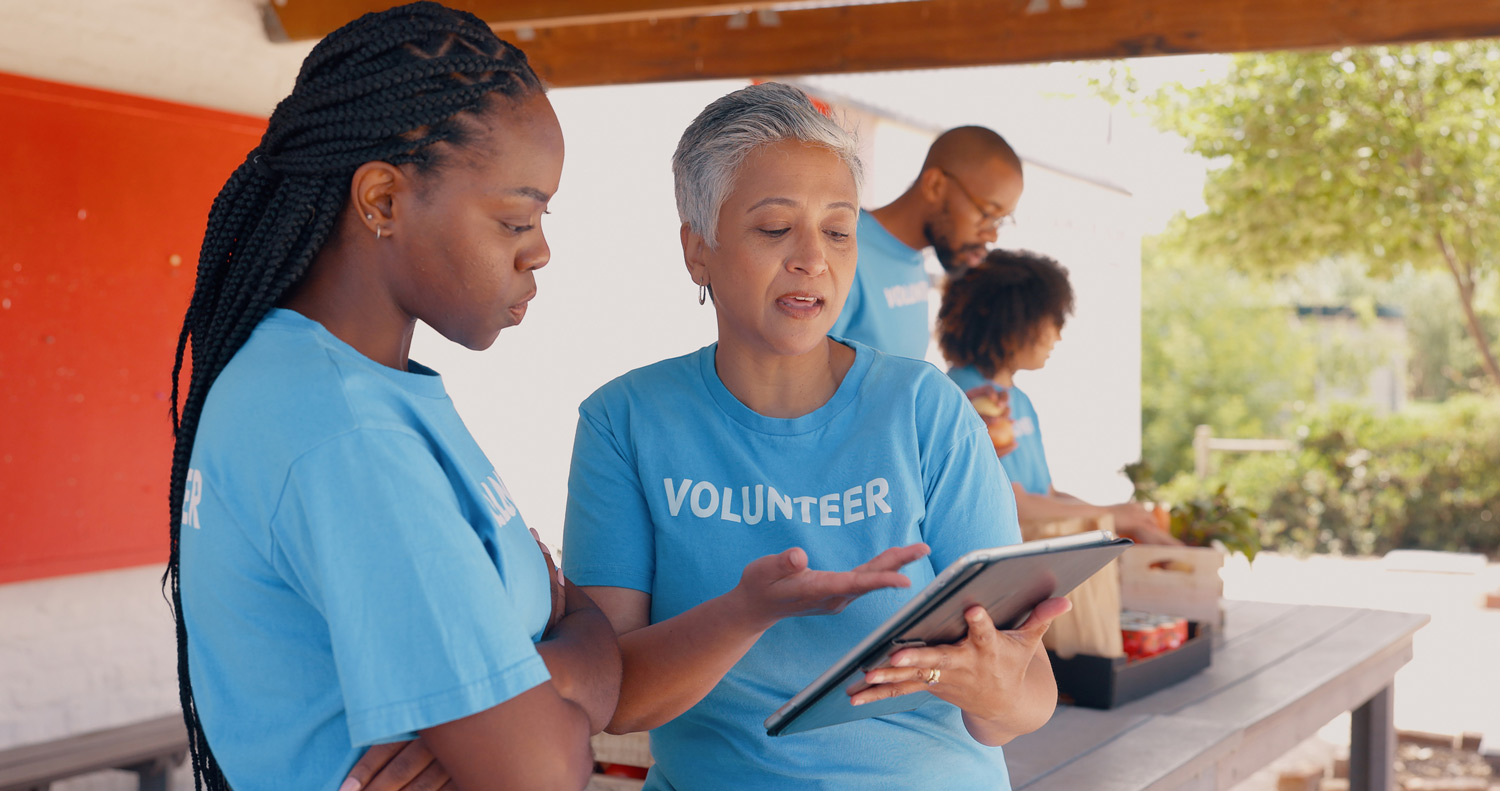 Two volunteers reviewing a checklist