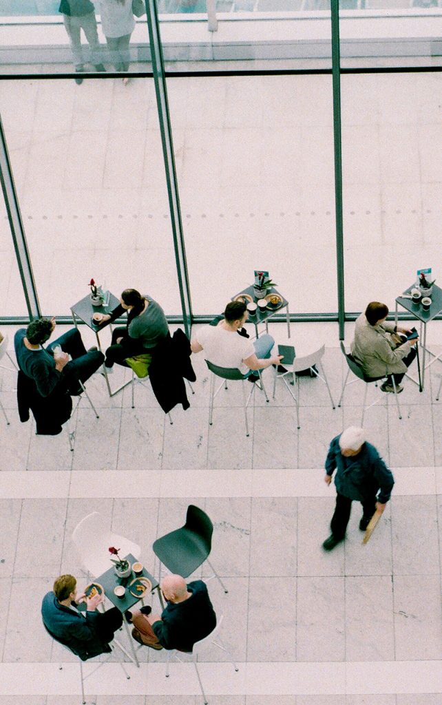 People eating and working in an open space