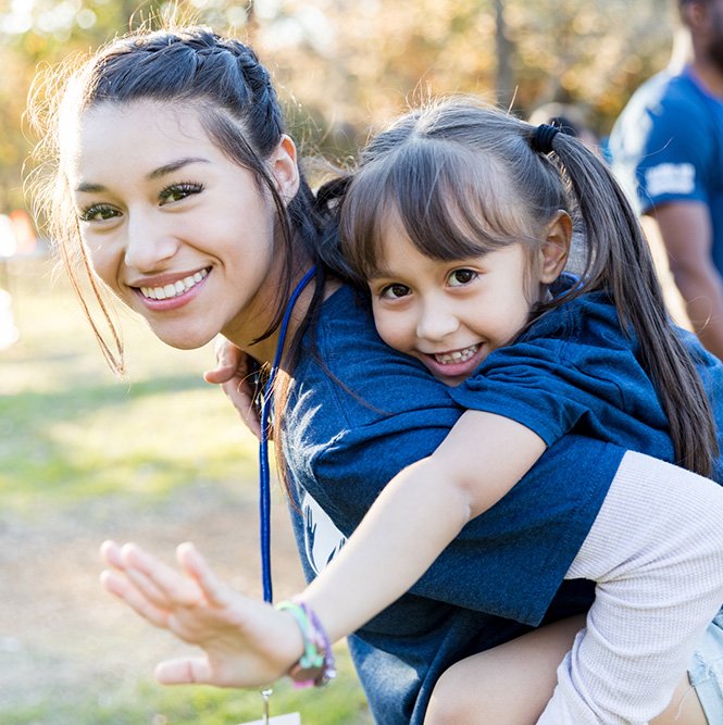 Woman with Girl Volunteers